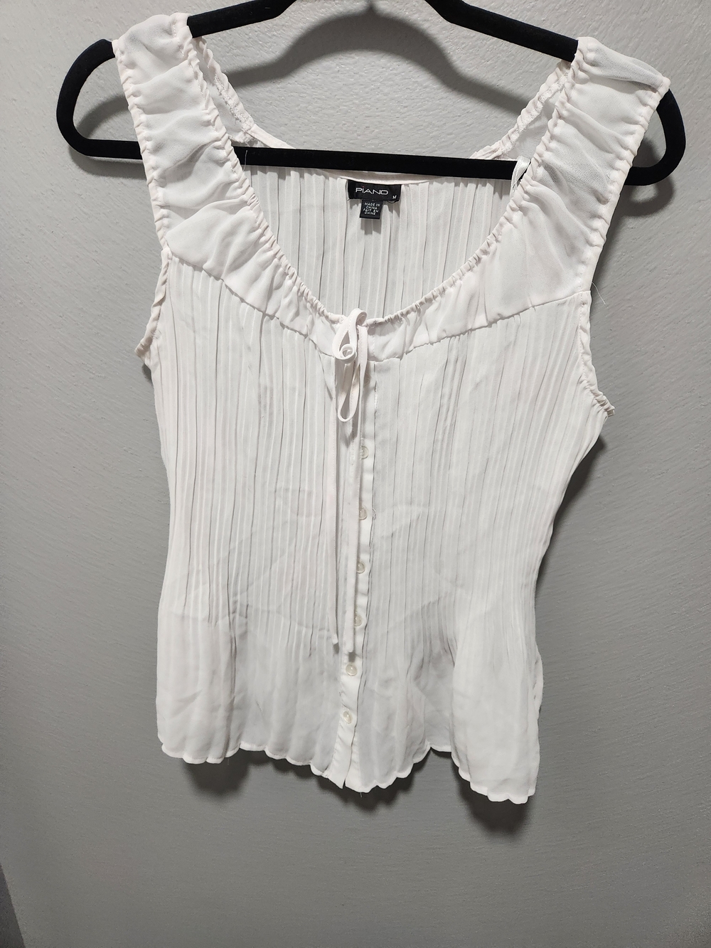 Pleated White Sleeveless Button-Front Blouse with Tie